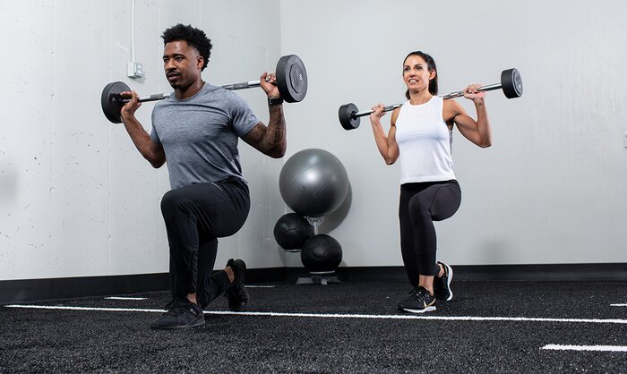 Figure 7 Man and Woman exercising with barbells